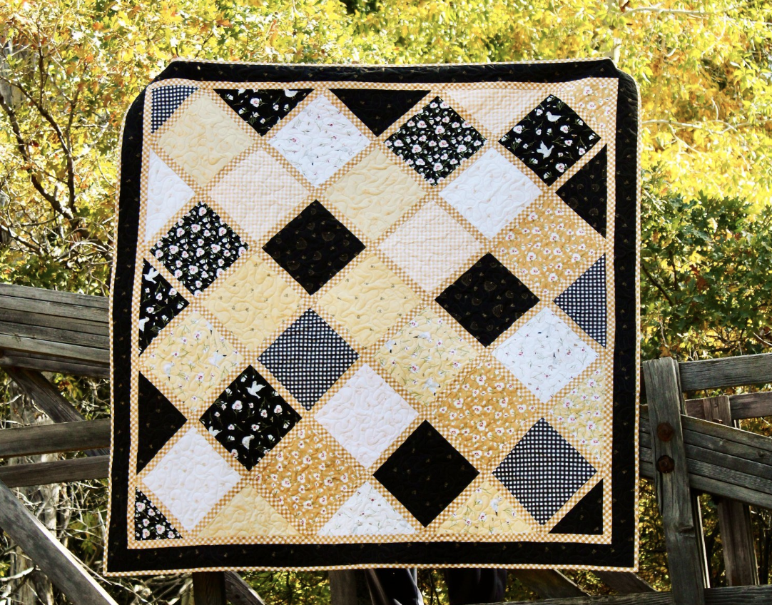 black and yellow patchwork quilt