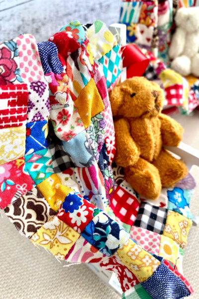 photo of miniature quilt with teddy bear