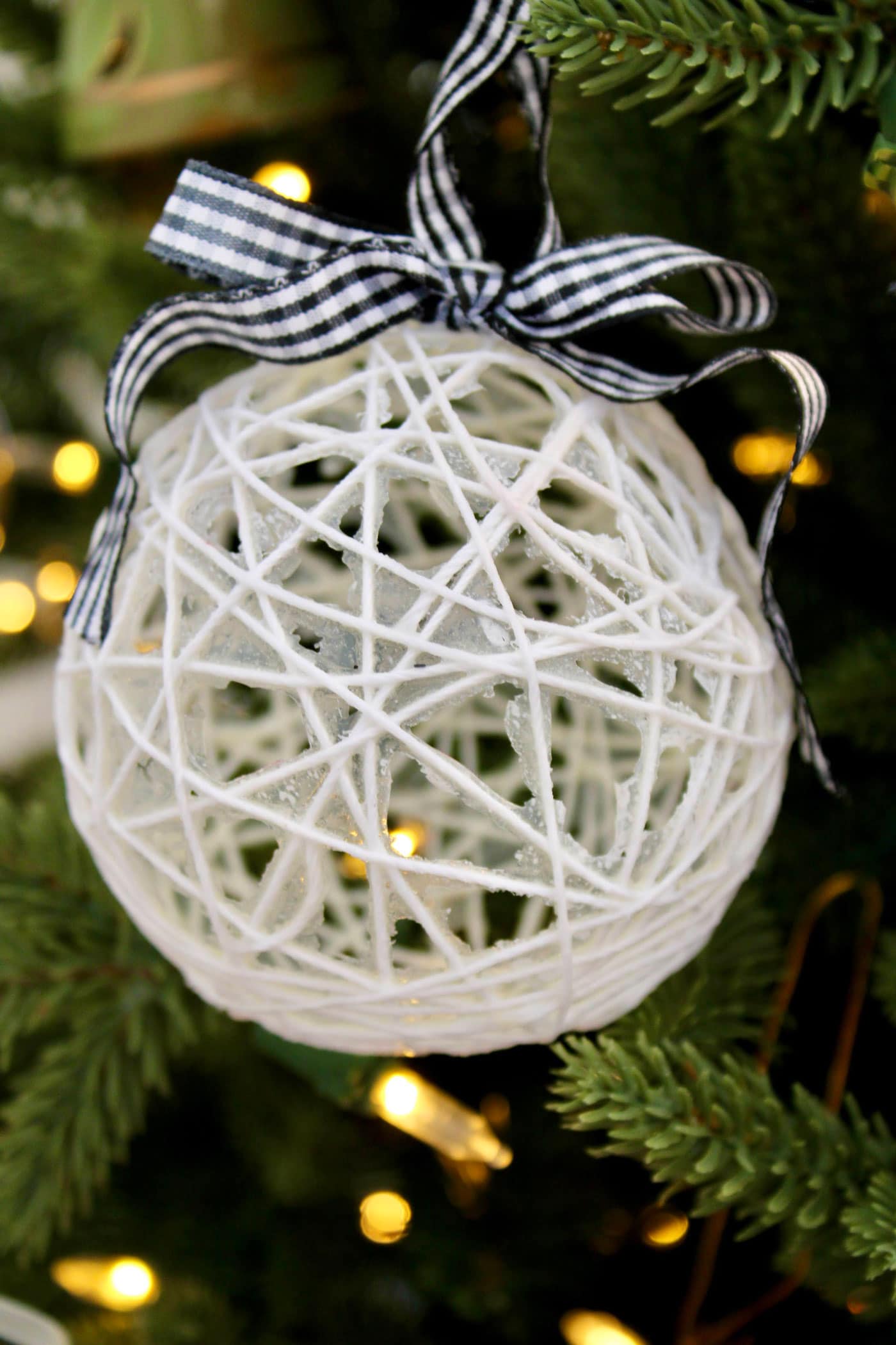 string christmas ornament on tree