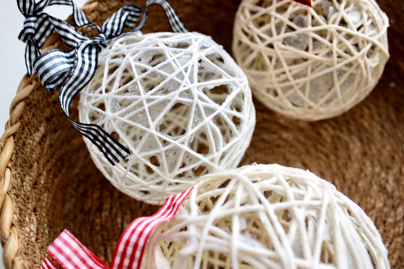 close up of basket of string christmas ornaments