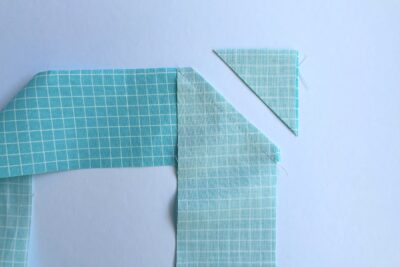 two blue fabric strips sewn together