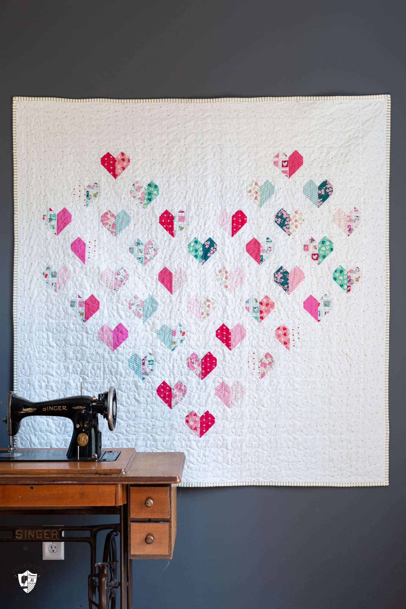 heart quilt hung on wall