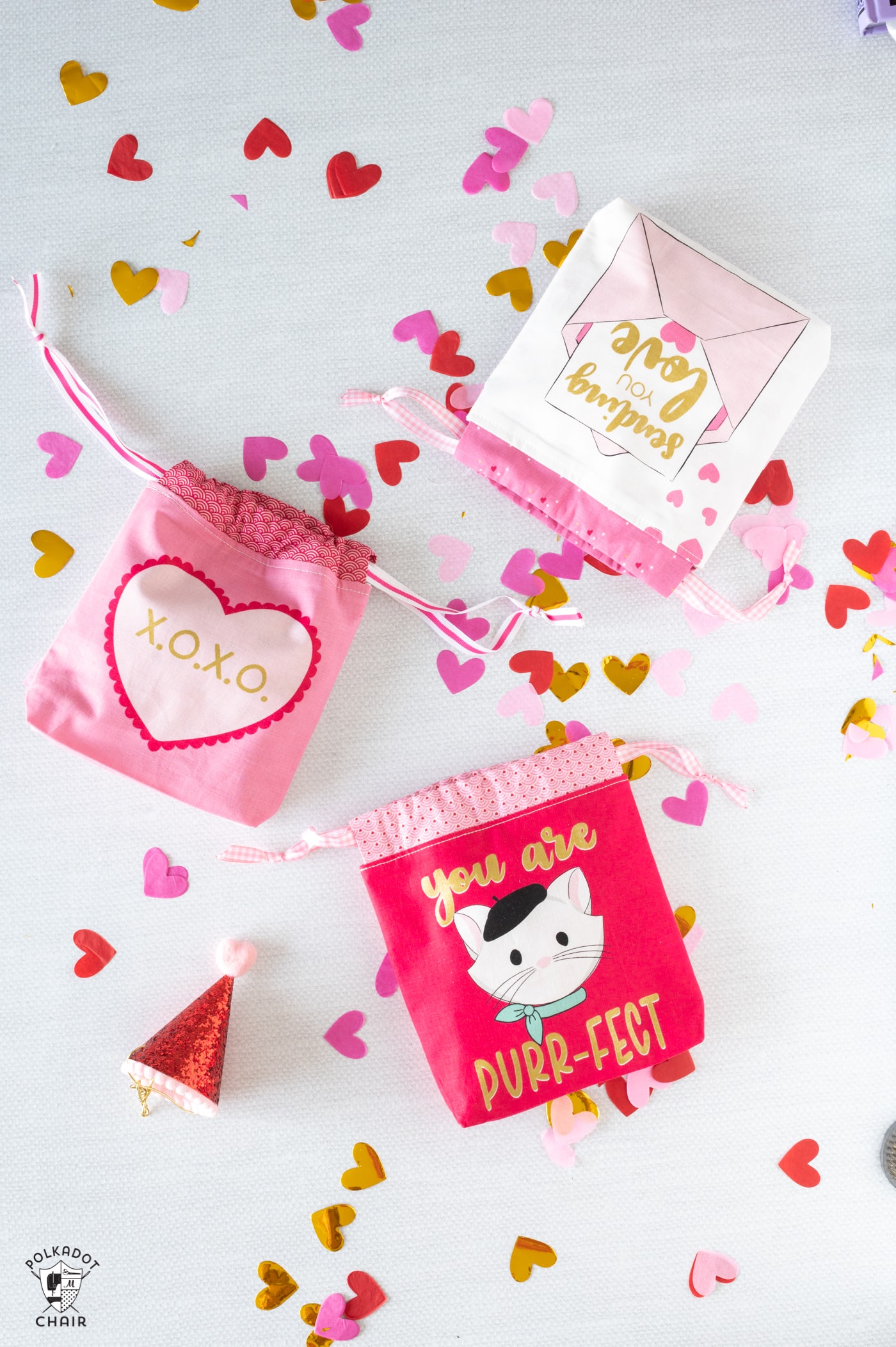 drawstring valentines day bags on white table