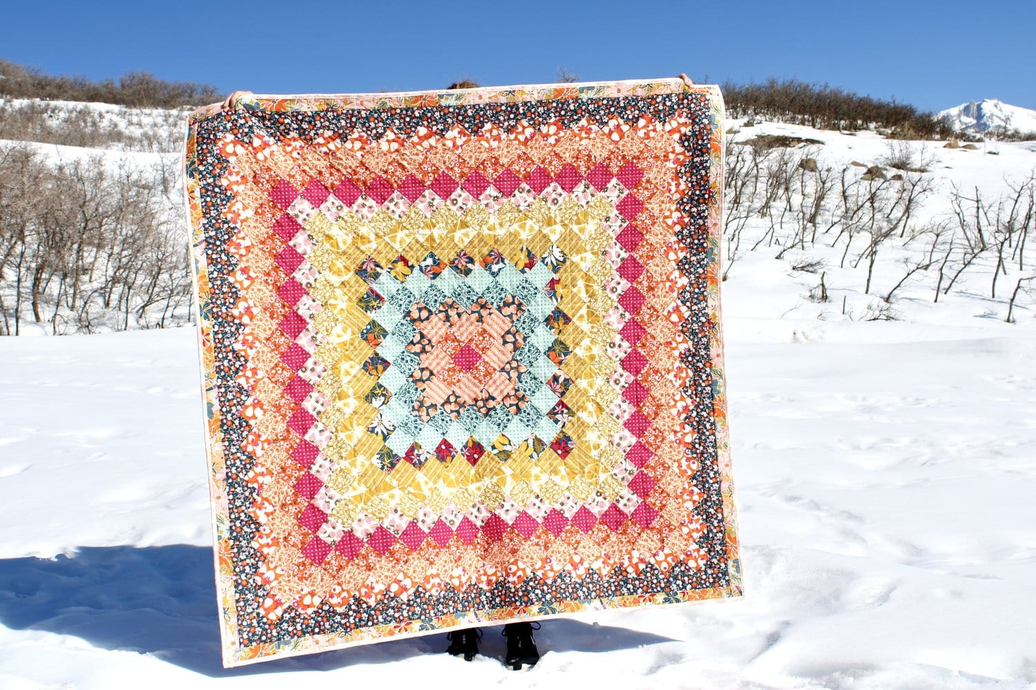 colorful quilt in snowy outdoors