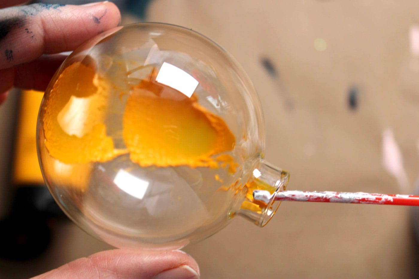 yellow paint inside of glass ornament