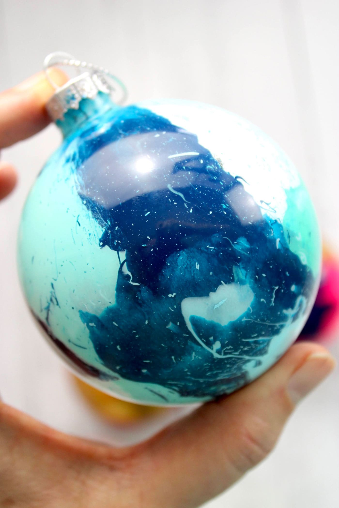 close up of paint inside of glass ornament