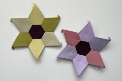 two pieced EPP stars on table