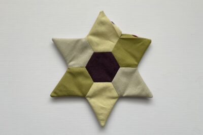 two pieced EPP stars on table