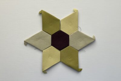 colorful basted star shaped EPP on table