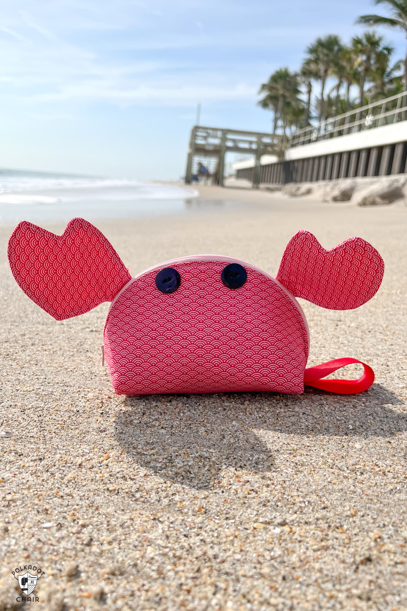 red crab zip bag on beach