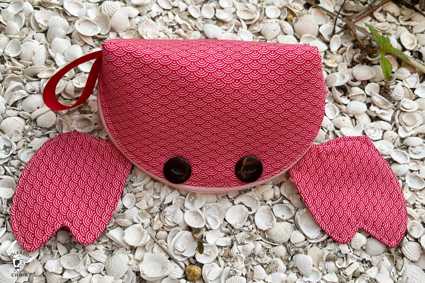 red crab zip bag on beach