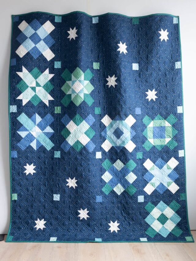 navy, blue and green quilt made from squares and rectangles - a modern granny square quilt pattern