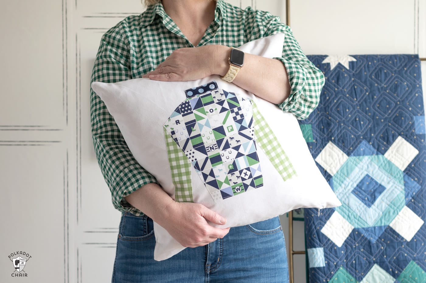 woman in green shirt holding jockey silks pillow