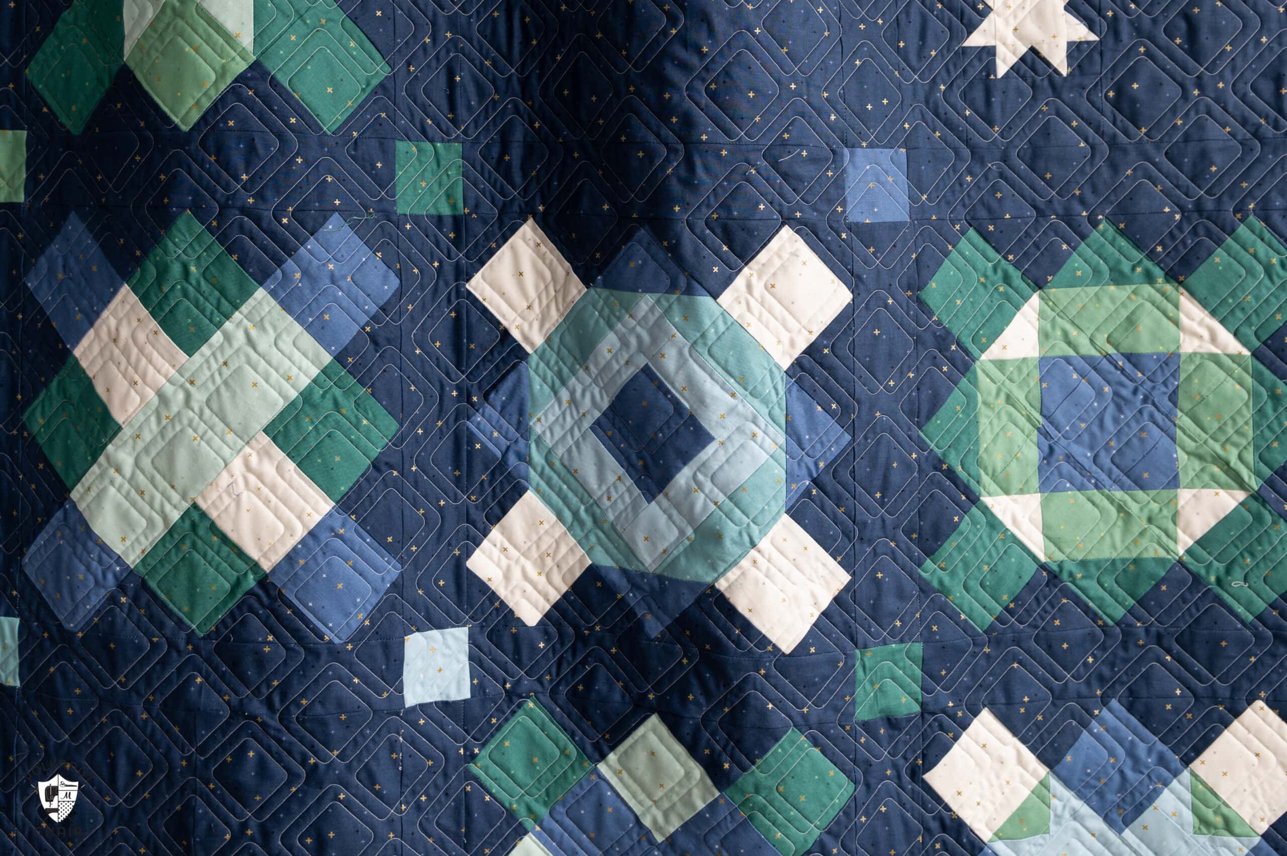 navy, blue and green quilt made from squares and rectangles - a modern granny square quilt pattern