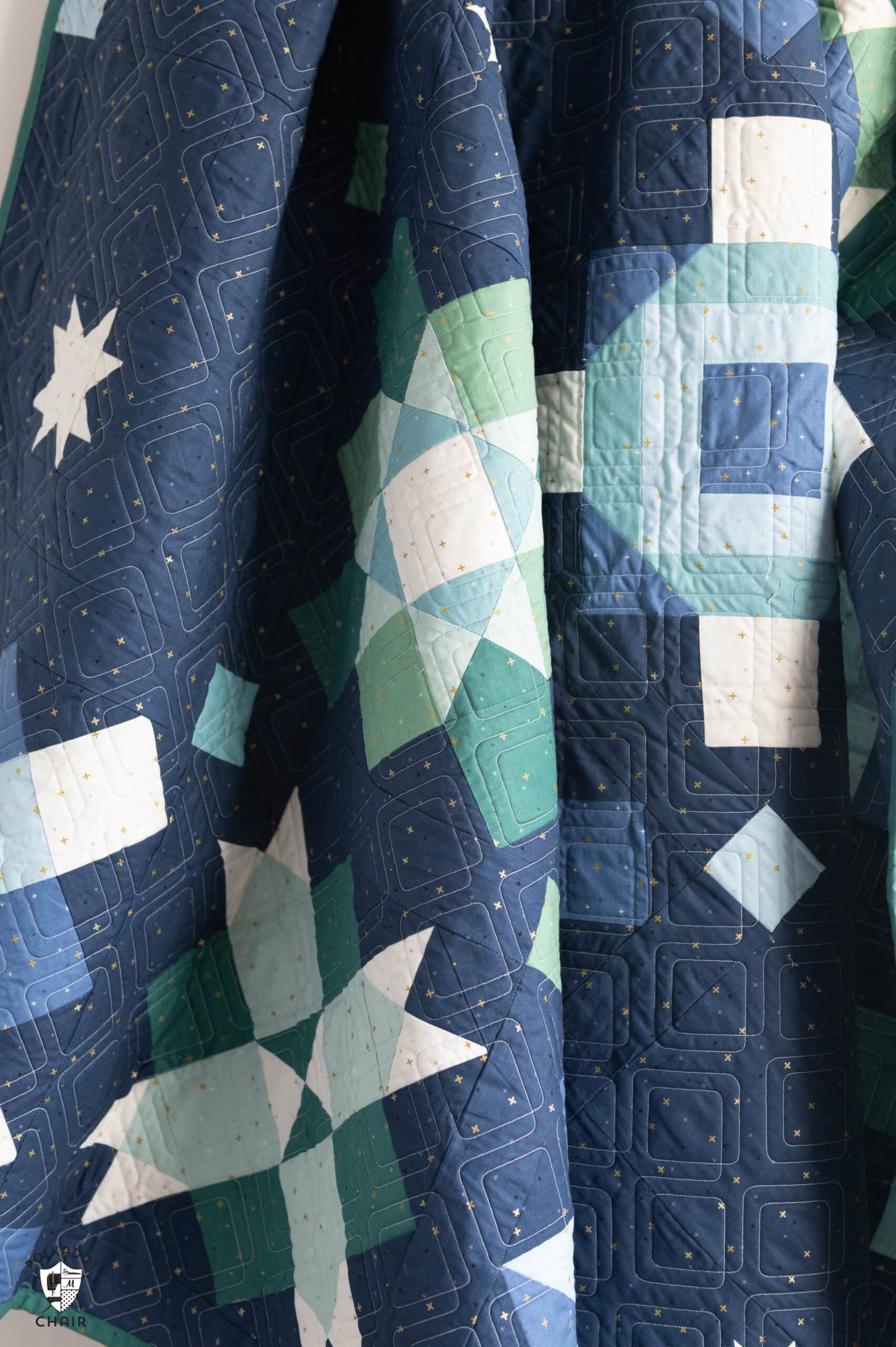 navy, blue and green quilt made from squares and rectangles - a modern granny square quilt pattern
