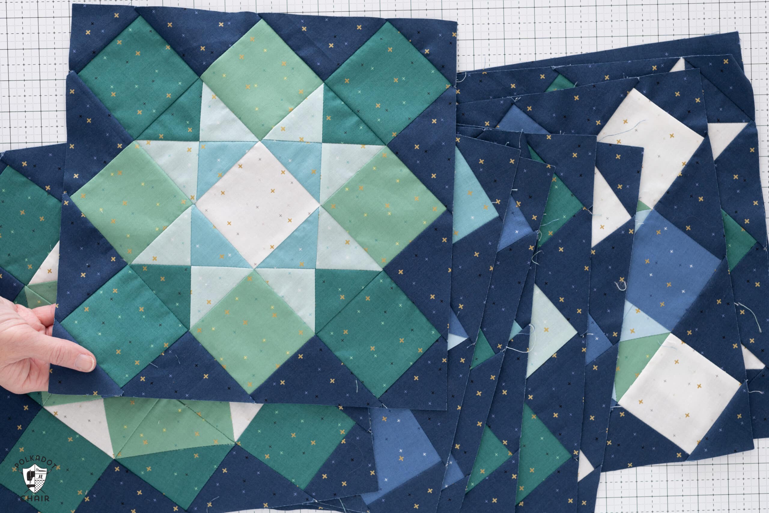 close up view of blue and green quilt blocks