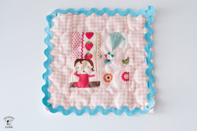 pink patchwork squares on white table top