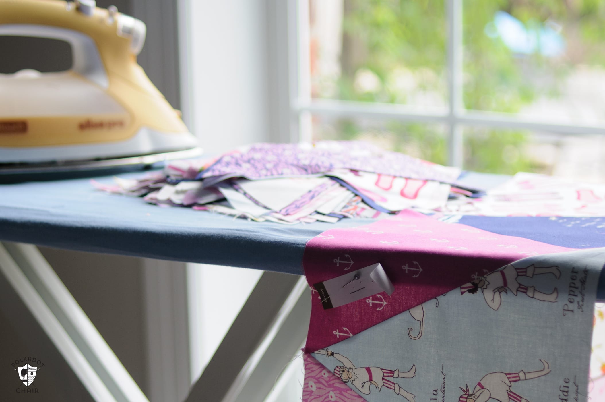 iron and ironing board with quilted triangles