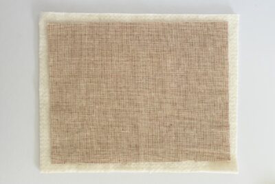 tan fabric on white table