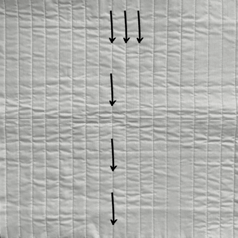 diagram of fabric with arrows showing quilting direction