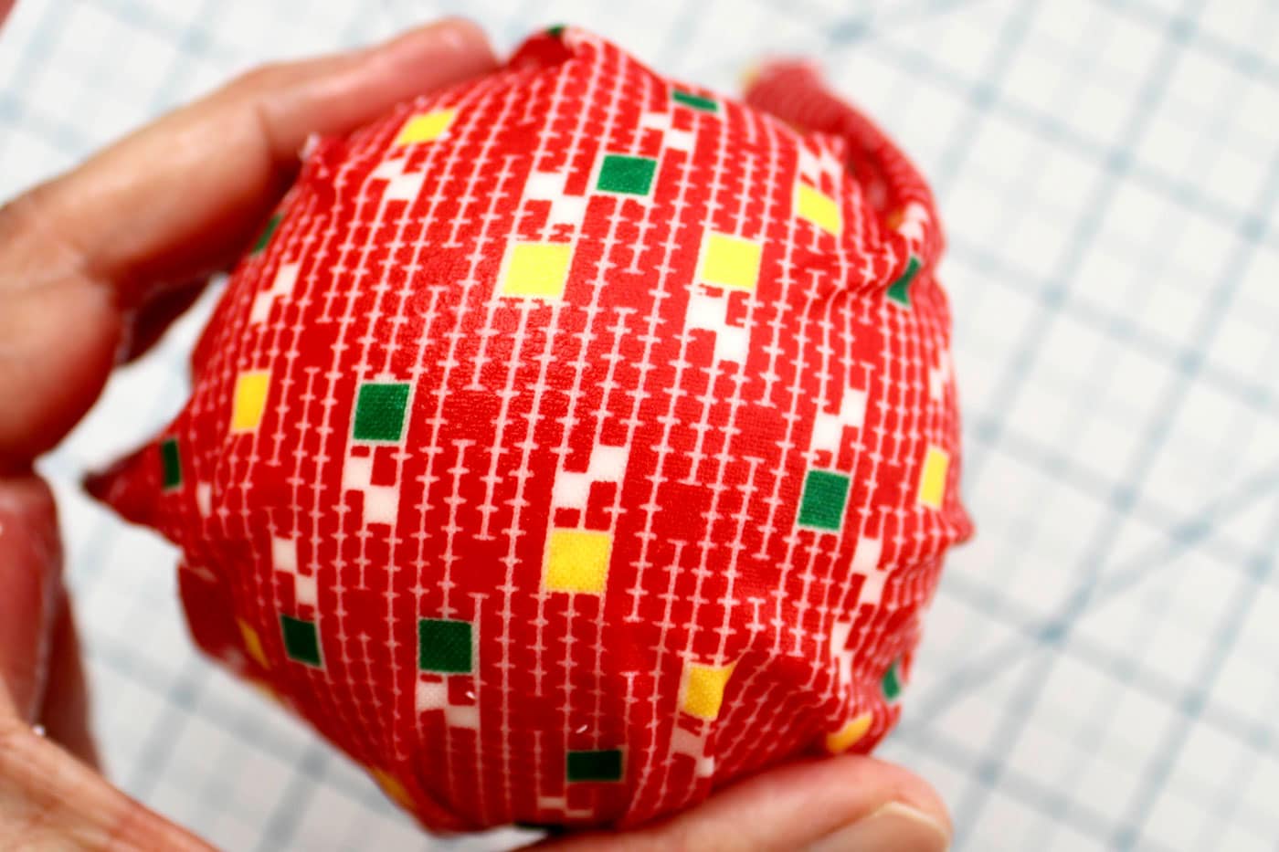 adding fabric to a styrofoam ball