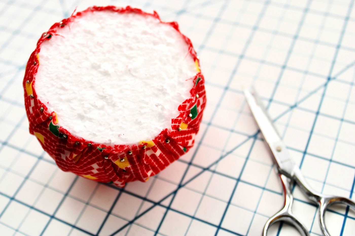 adding fabric to a styrofoam ball