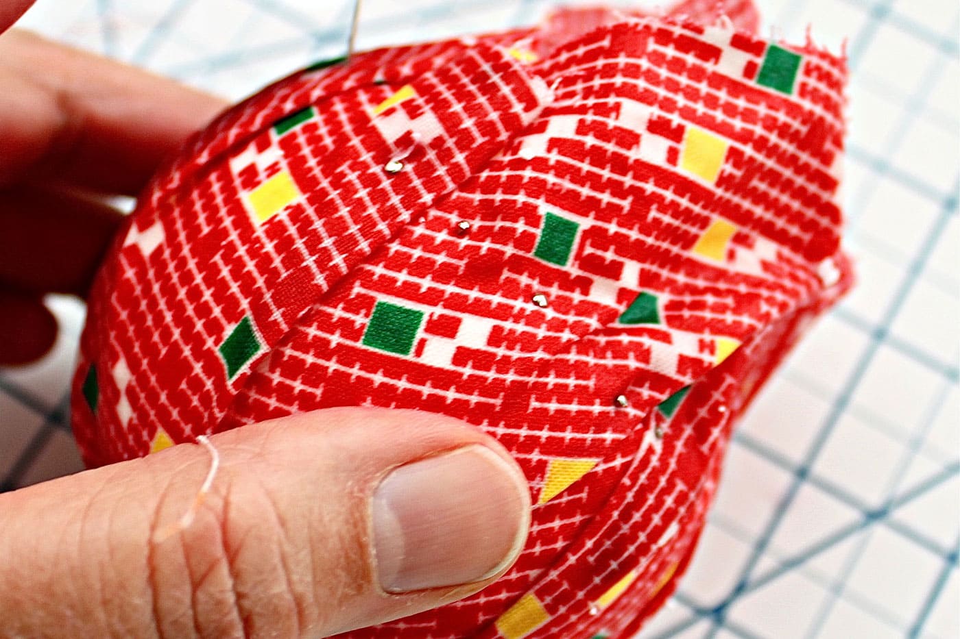 adding fabric to a styrofoam ball