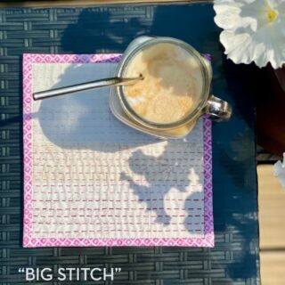 iced coffee on cream and pink mug rug