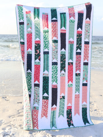 colorful flag quilt on beach