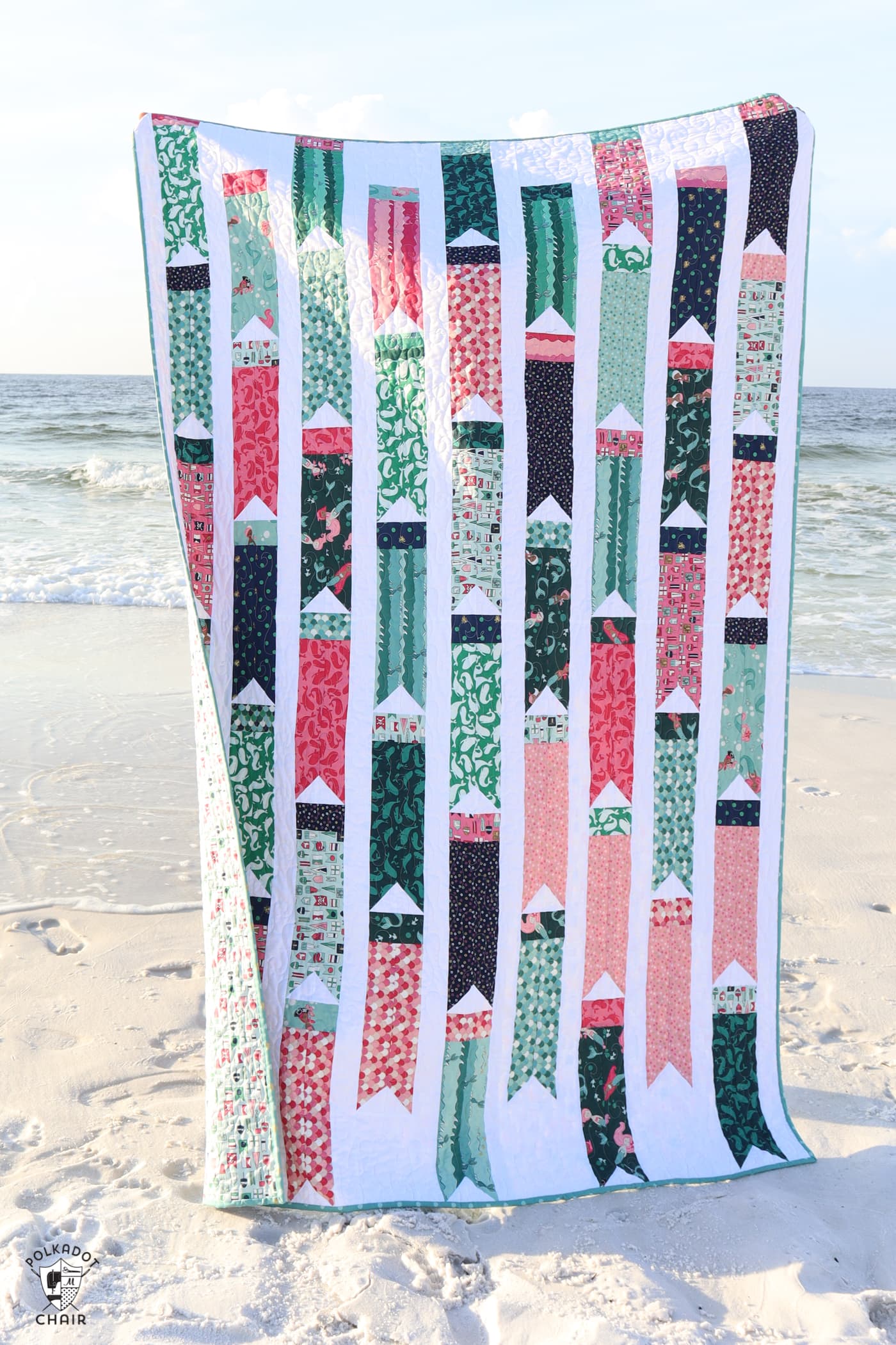 colorful flag quilt on beach