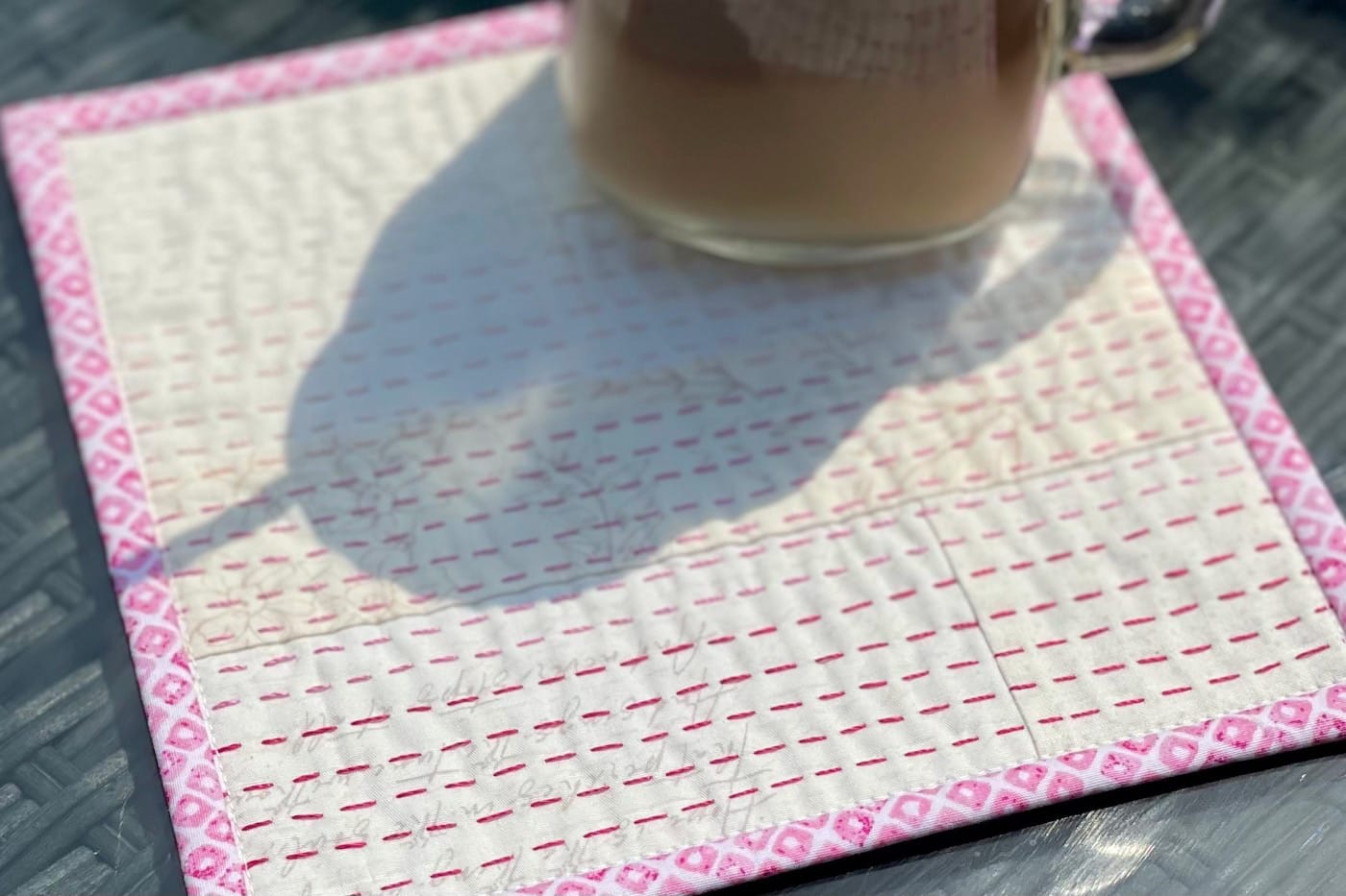 iced coffee on cream and pink mug rug