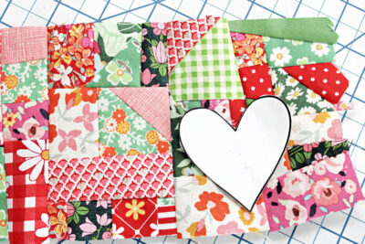 colorful fabric scraps on table with heart
