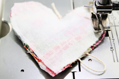 patchwork heart and string on sewing machine