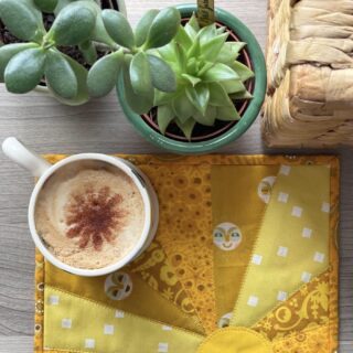 yellow sun mug rug and mug on table outdoors