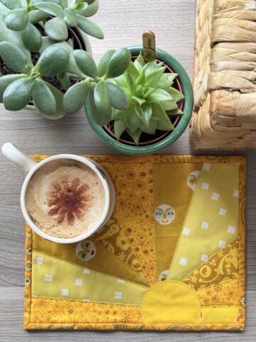 yellow sun mug rug and mug on table outdoors