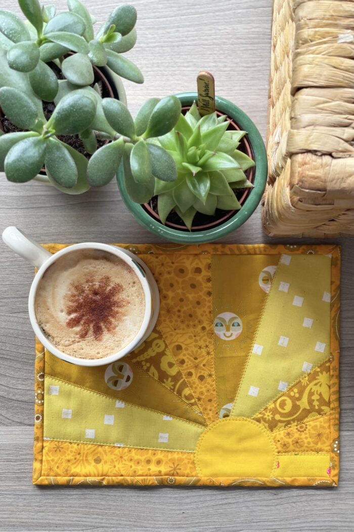yellow sun mug rug and mug on table outdoors