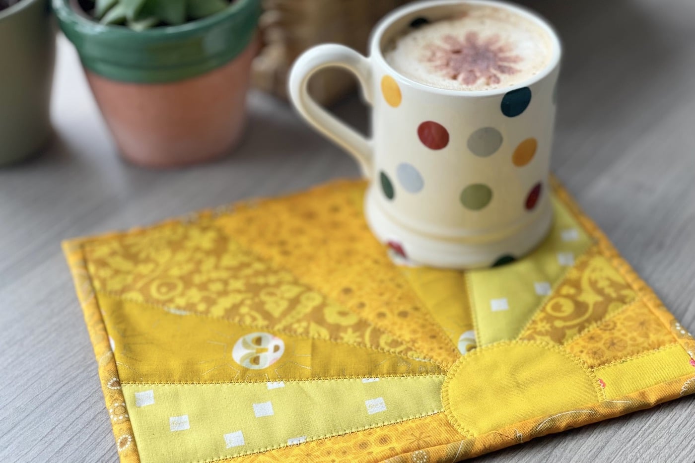 yellow sun mug rug and mug on table outdoors