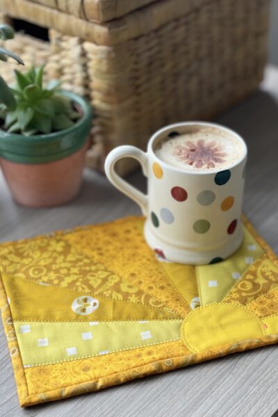yellow sun mug rug and mug on table outdoors