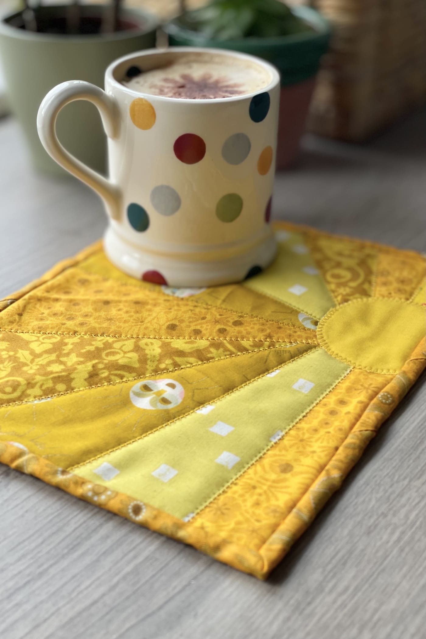 yellow sun mug rug and mug on table outdoors