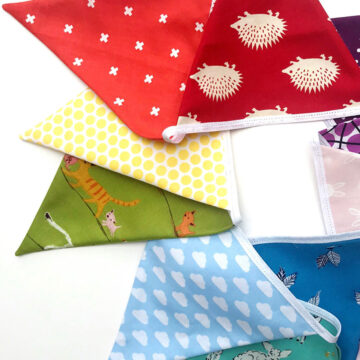 triangle fabric flags on white table top