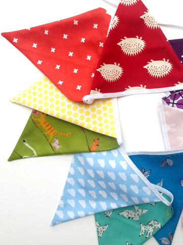 triangle fabric flags on white table top