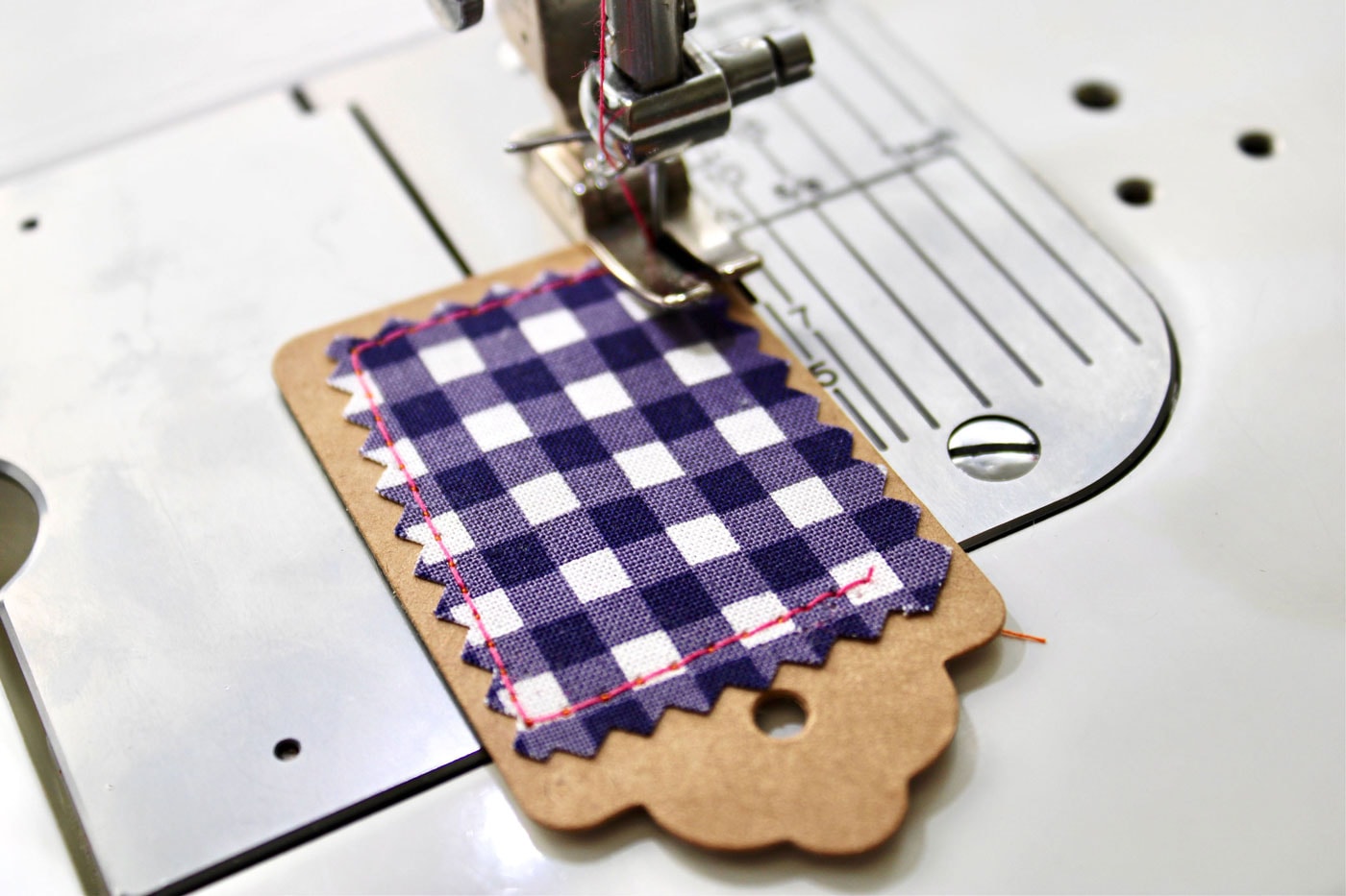 fabric tag under sewing machine foot