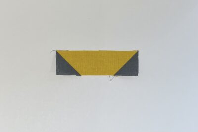 gray and yellow fabrics on white table