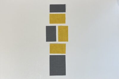 gray and yellow fabrics on white table