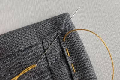 close up of yellow stitching thread