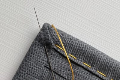 close up of yellow stitching thread