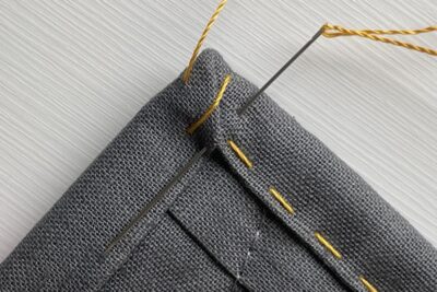 close up of yellow stitching thread