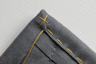 close up of yellow stitching thread