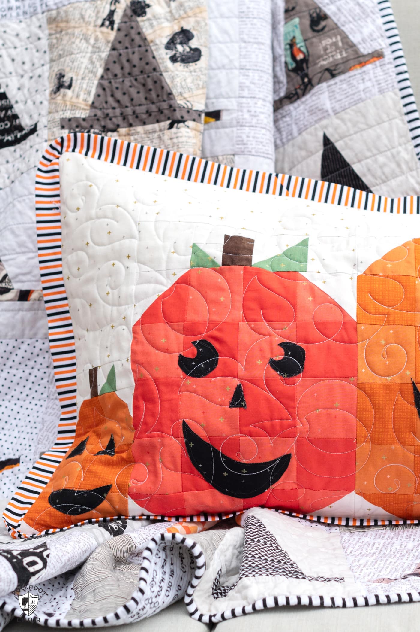 quilted pillow with 5 pumpkins outdoors