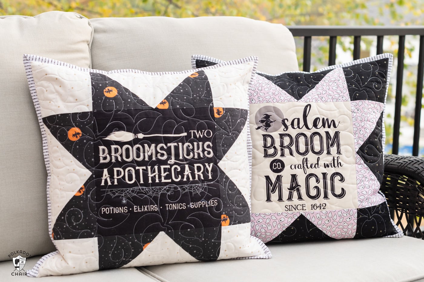 two black and white pillows on couch outdoors with halloween quilt